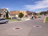 Road view showing workman laying porch and garage floors