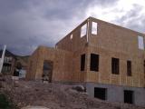 Back of house from back left corner of garden showing single garage on left