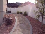 Left side gate and path coming into back of house