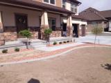 Red rock in place at front of house