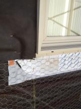 Preparation for stuco on the outside walls below window - timber, plastic sheeting then chicken wire after which the stuco paint is applied