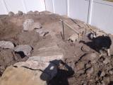 Lower rock wall and building pit