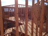 Standing in Laundry looking through framing to master bedroom on left and 2nd bedroom on right with hallway in middle
