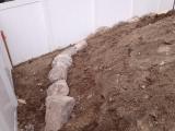 Lower rock wall and building pit