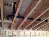 Plumbing under master bedroom viewed from basement