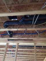 Plumbing under master bedroom viewed from basement